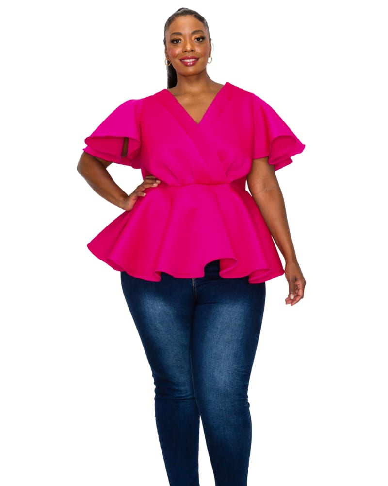 Front of a model wearing a size 1X Siobhan Peplum Top in Fuchsia by L I V D. | dia_product_style_image_id:300494